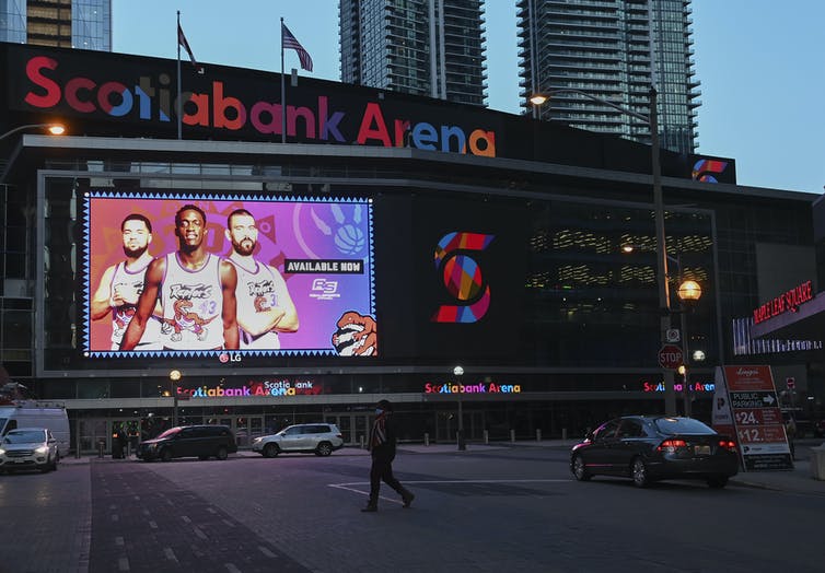 Scotiabank Arena with a billboard-sized image of the Toronto Raptors in front