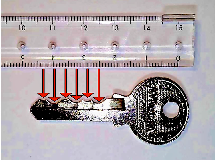 A ruler is next to a key. Red arrows show how the key's intendations are evenly spaced.