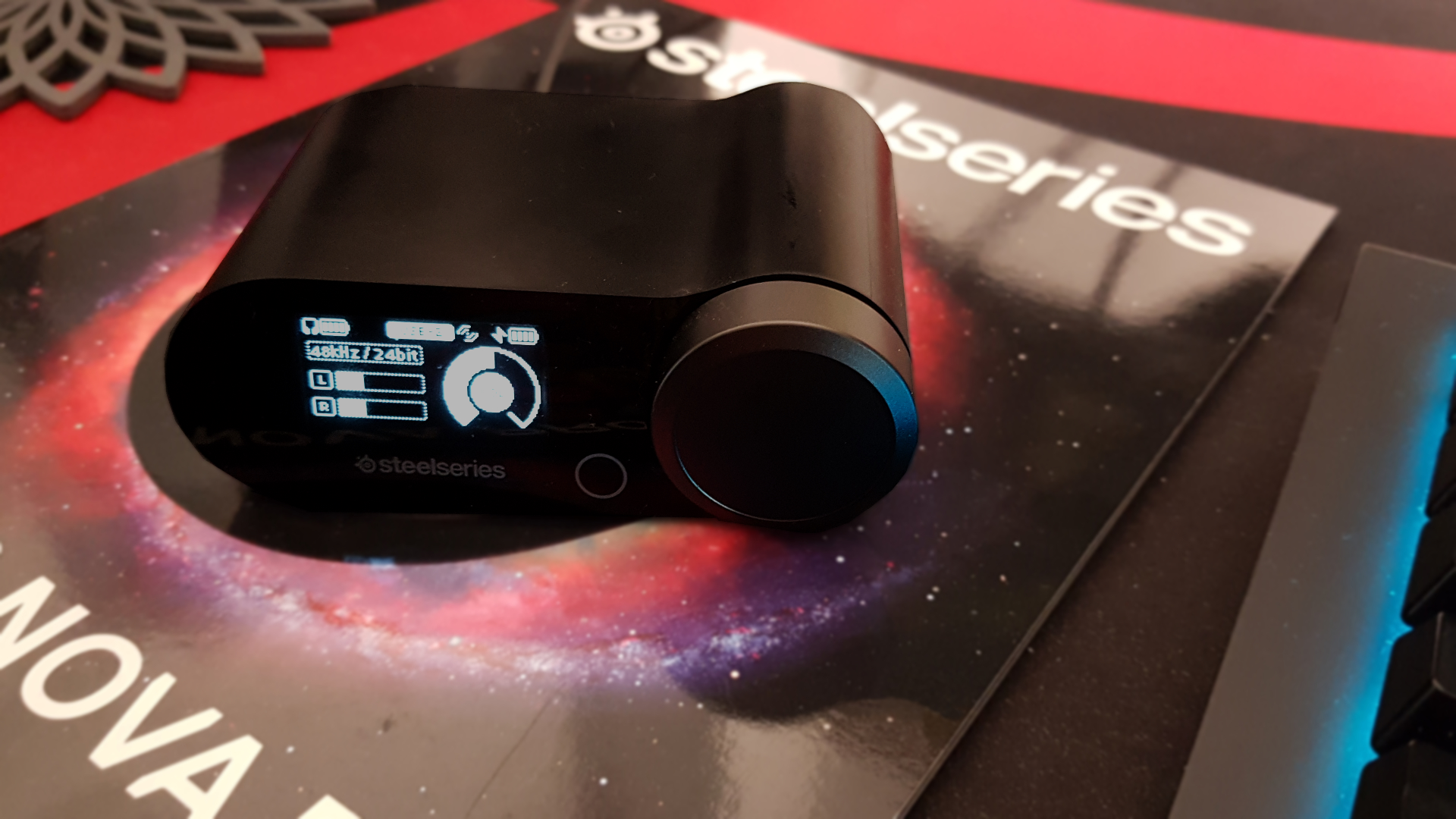 The SteelSeries Arctis Nova Pro wireless game DAC on a desk.