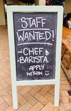 Chalkboard seeking staff to fill vacancies that says: 