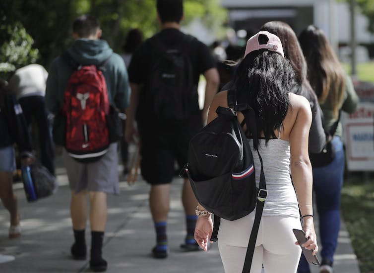 Students seen walking on a campus