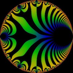 A circle containing curving black stripes against other colors, mostly yellow, green, and blue.